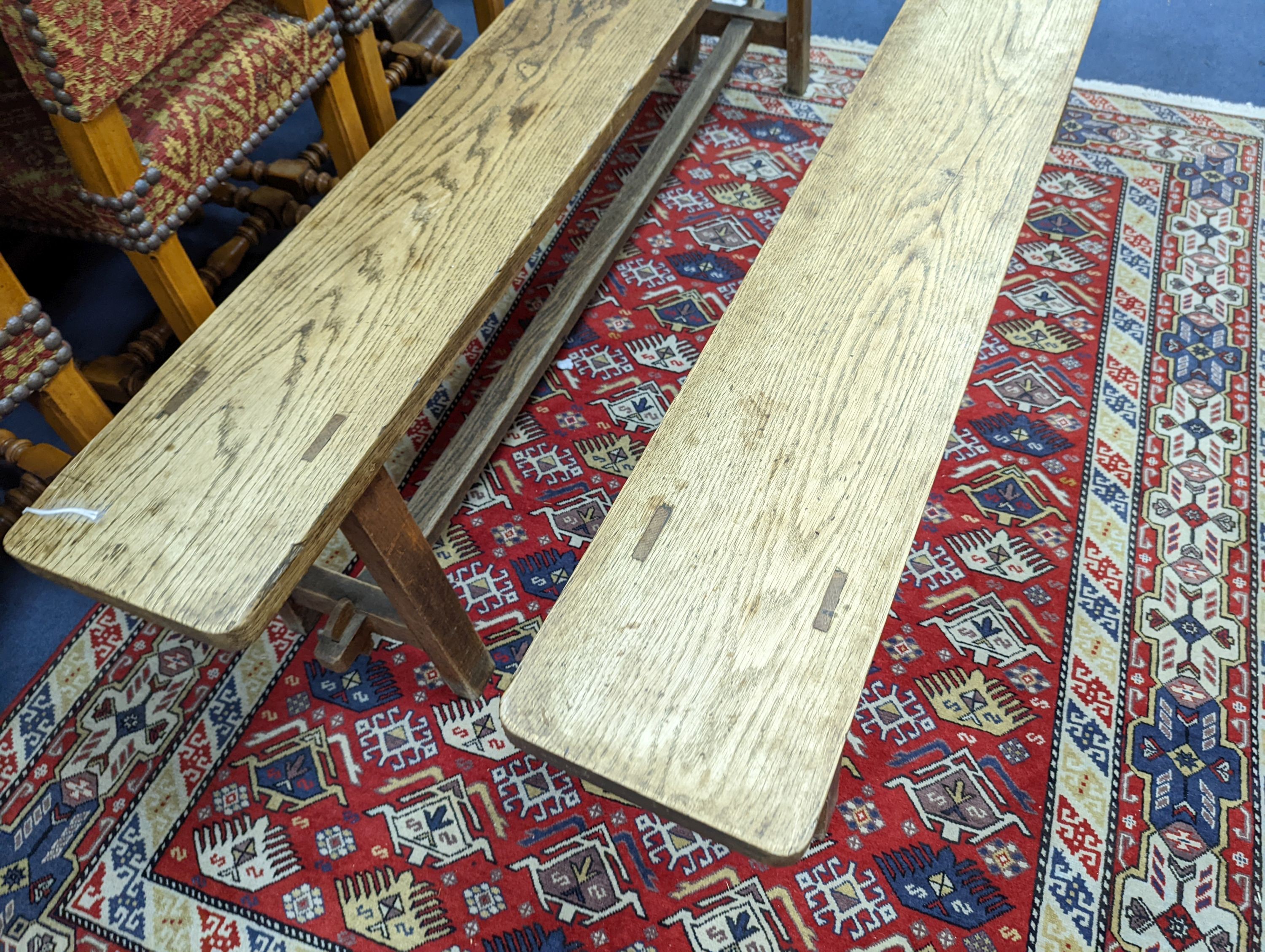 A pair of 19th century French provincial oak bench seats, length 170cm, depth 22cm, height 44cm